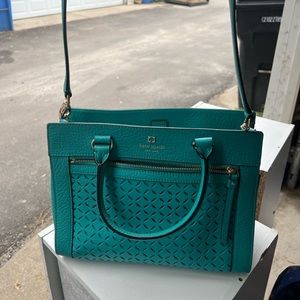 Basically brand new. Kate Spade teal purse